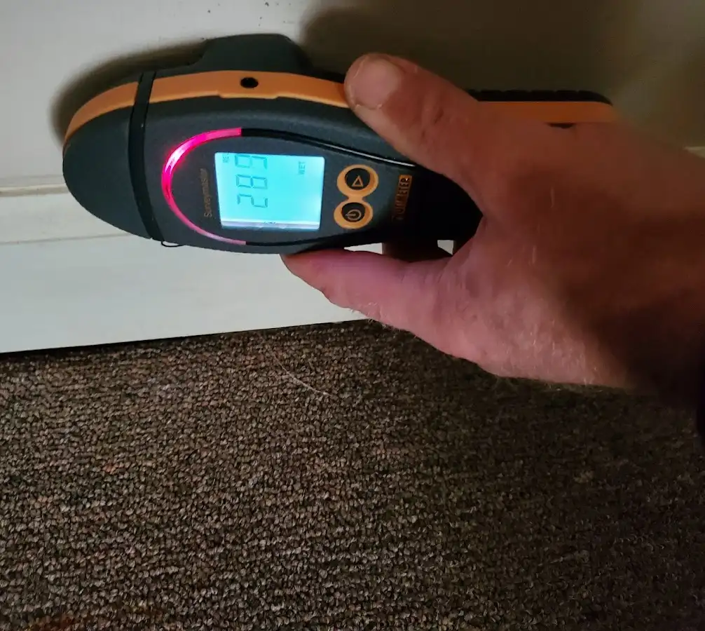 Moisture detection at baseboard during Storm Damage Restoration in Santa Maria